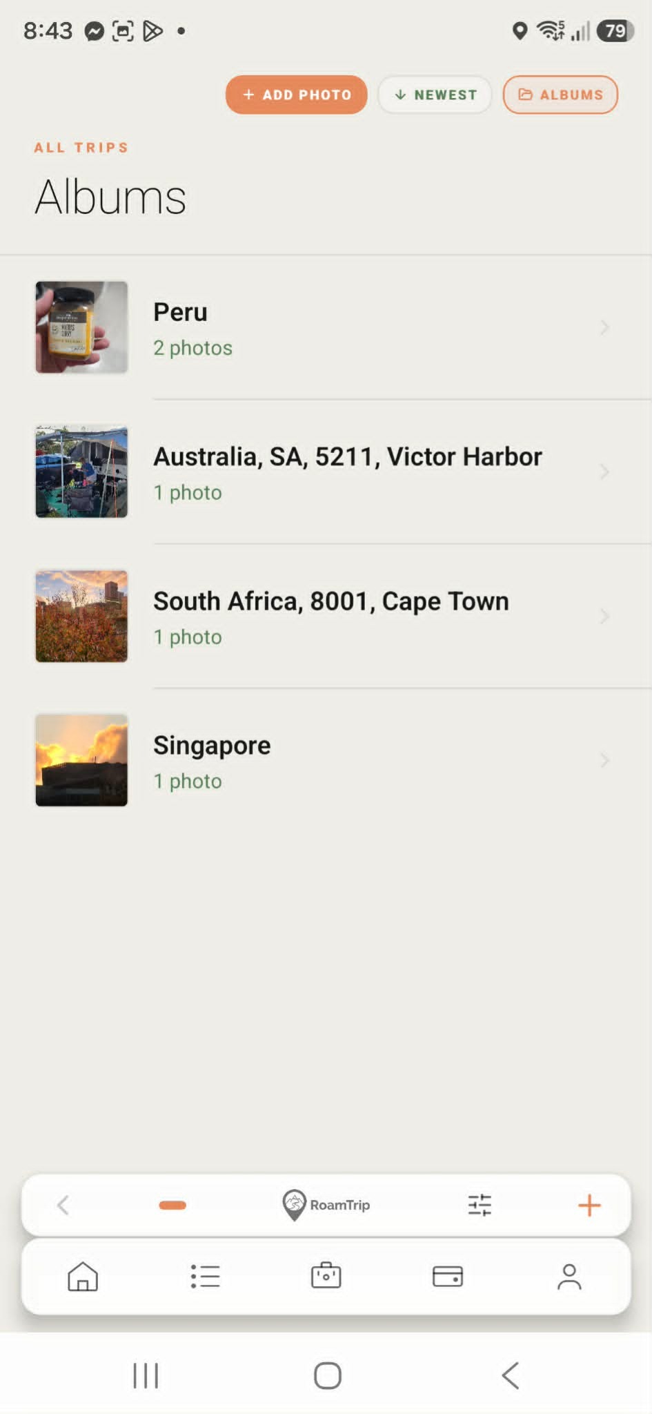 RoamTrip Albums screen with trip photo collections